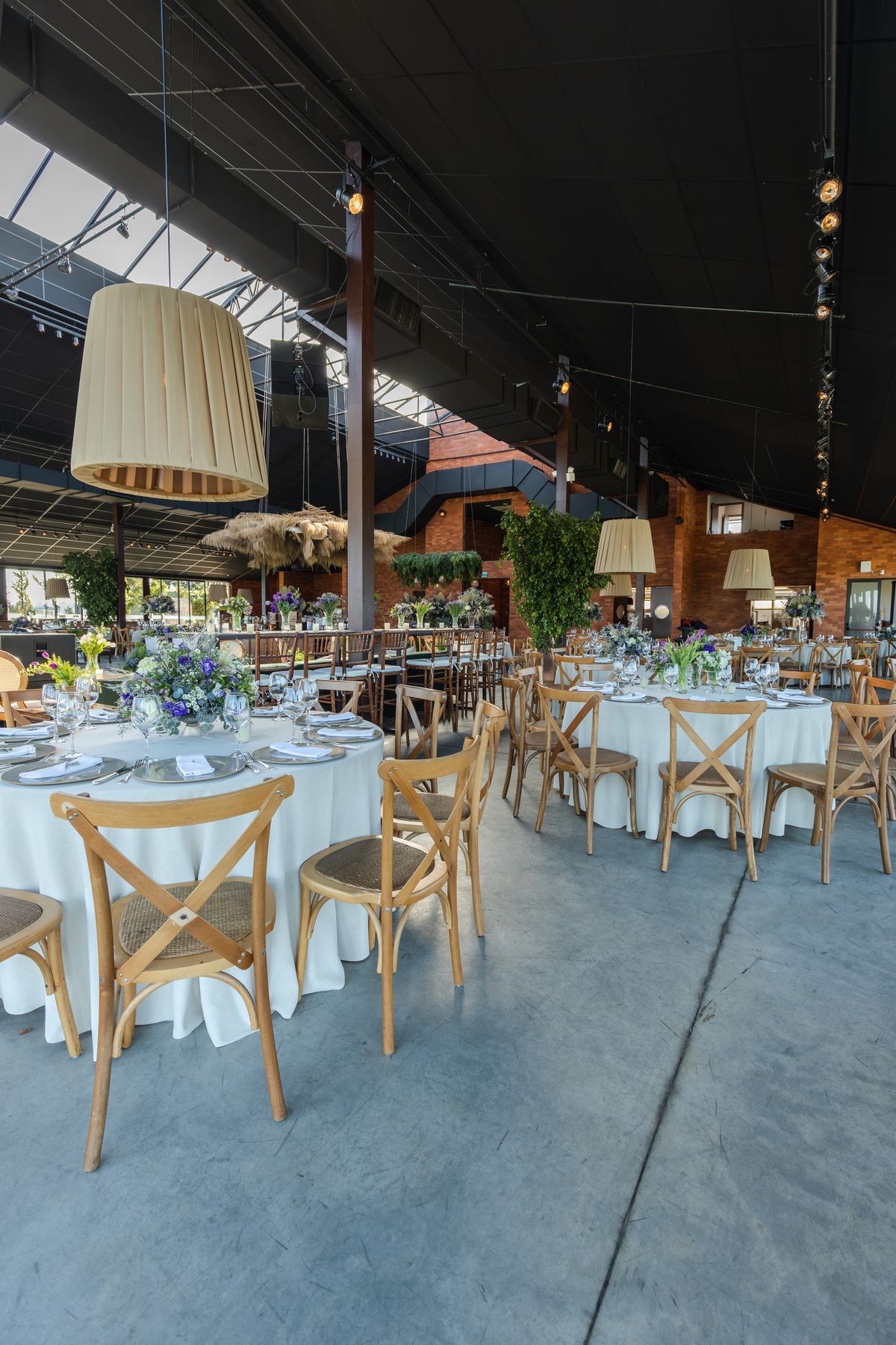 Elegant indoor event venue arranged with dining tables